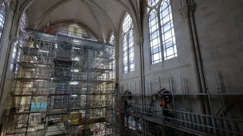 Romaric Toussaint © Etablissement public Rebâtir N Workers inside Notre-Dame cathedral