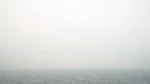 Getty Images Sydney Harbour Bridge obscured by grey smoke