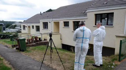 Wales News Service Police outside house in Elliotstown