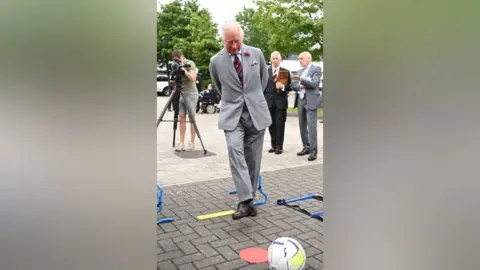 PA Media Prince Charles takes aim and shoots