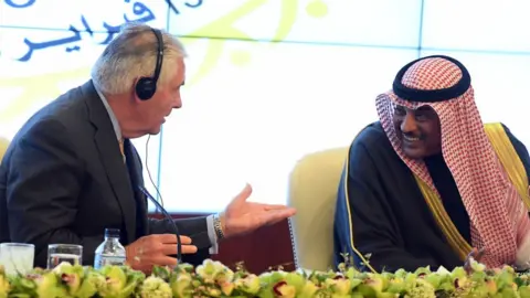 Getty Images Mr Tillerson (left) was fired shortly after a diplomatic tour of the Middle East