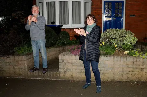 Getty Images Residents in Northampton cheer for the NHS