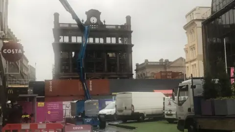 The damaged building is in the middle of Belfast's main shopping thoroughfare