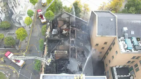 Northern Ireland Fire & Rescue Service An aerial view of the damage to the top of the roof