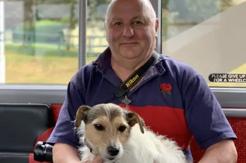 Derek Perry with his dog