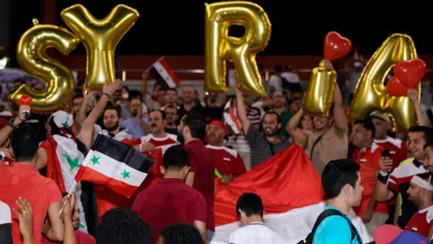 Stanley Chou/Getty Images Syrian fans for game against Australia