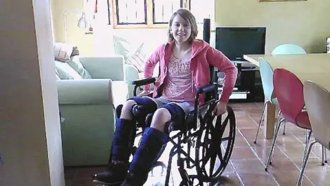 Emily Koch Author Emily Koch in a wheelchair after her accident