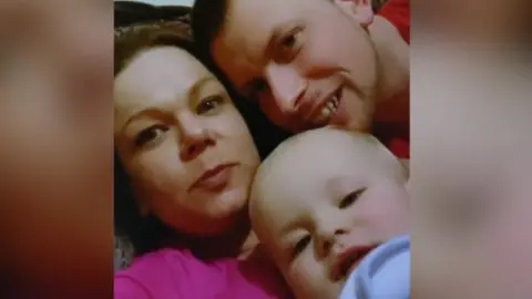 Family photo Faye with her partner and baby