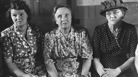 Getty Images Three members of Bishop Itchington parish council pictured in 1951