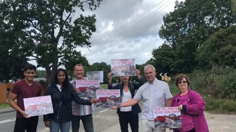 Campaigners at the entrance to Five Oaks Farm in Shedfield