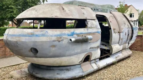 A science fiction spaceship on a drive in Leighton Buzzard