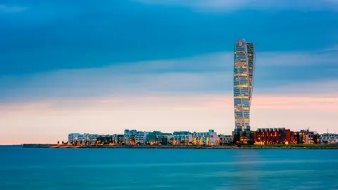 Getty Images Skyline of Malmo, Sweden with famous Turning Torso building, captured around sunset