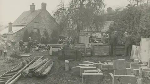 Henry Ford Museum Men packing stones into sacks