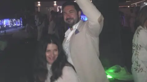 Adrian Parsons Rhys and Lisa Williams at a party