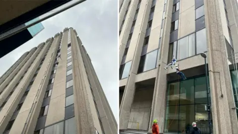 People abseiling Castlemead building