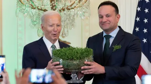 Reuters Joe Biden and Leo Varadkar exchange a bowl of shamrock