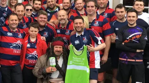Aylestone Athletic RFC David Carroll with members of Aylestone Athletic RFC for a charity run