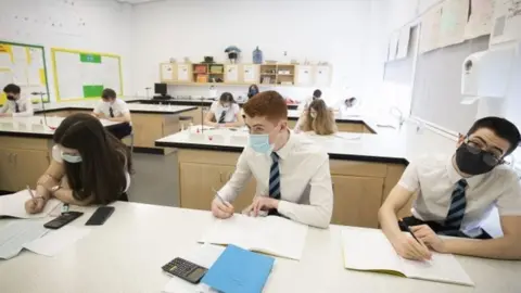 PA Media Pupils wearing masks