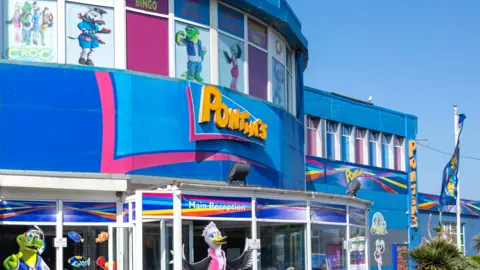 Alamy Main reception building at Pontins Camber Sands Holiday Park, Camber, East Sussex, England