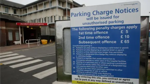 PA Media Sign at Oldham Royal Hospital to illustrate hospital car parking charges