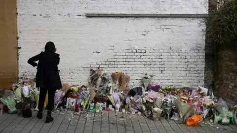 AFP Temporary memorial set up for Israel Ogunsola who was stabbed to death in Hackney on 4 April