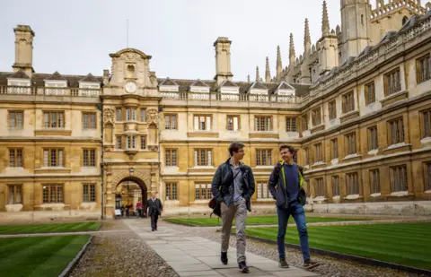 Getty Images Students walking through one of the Cambridge colleges