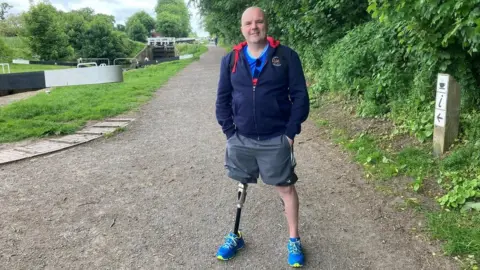 BBC Stacey Cresswell standing on the Caein Hill towpath a stretch of the Kennet and Avon canal that he will use to train for 100km across the Sahara in November