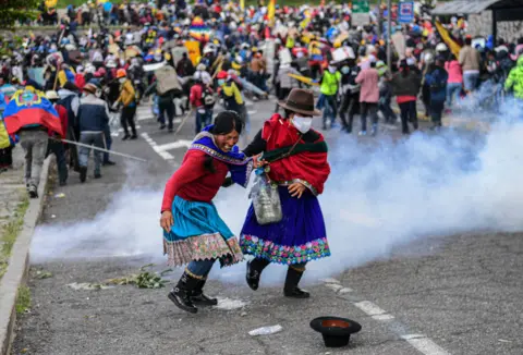 MARTIN BERNETTI / AFP Demonstrators clash with the police in Arbolito Park in Quito, Ecuador on 23 June 2022.