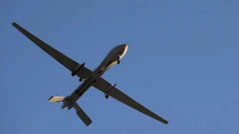 Getty Images A US predator drone flying on a mission in the Persian Gulf in 2016