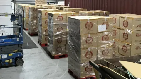 Justice Minister welcomes seizure of 15 million cigarettes