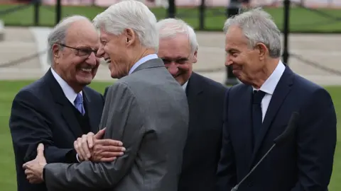 PA Media Former senator George Mitchell, President Bill Clinton, former Taoiseach Bertie Ahern and former Prime Minister Tony Blair in Belfast