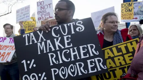 AFP/Getty Demonstrators against the Republican tax reform bill hold a 'Peoples Filibuster to Stop Tax Cuts for Billionaires,' protest rally outside the US Capitol on Capitol Hill in Washington, DC, November 30, 2017.