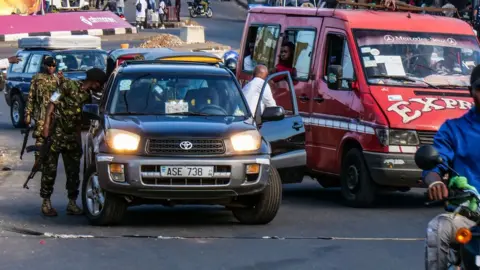 EPA Soldiers check vehicles at a road block in Freetown, Sierra Leone, 27 November 2023.