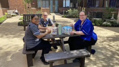 United Lincolnshire Hospitals NHS Trust Staff try out the newly created garden at Lincoln County Hospital
