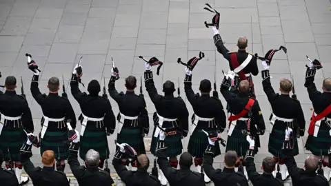 Oli Scarff/AFP/Getty Members of the royal regiment of Scotland react outside of the St Giles' Cathedral in Edinburgh during the ceremony of the proclamation of Britain's King Charles III