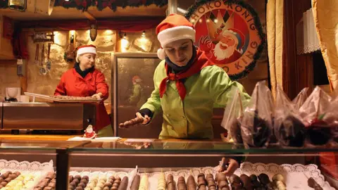 Getty Images A chocolatier prepares her display at Birmingham's Frankfurt Christmas market