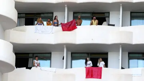 Reuters Students visiting from the mainland to celebrate the end of term are isolated in a hotel in Palma de Mallorca after testing positive for coronavirus, Spain, 28 June 2021
