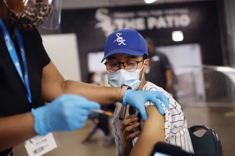 Getty Images A young Chicago White Sox baseball fan get jabbed at a game