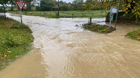 Shannon Eustace/BBC Flooded road near Ipswich