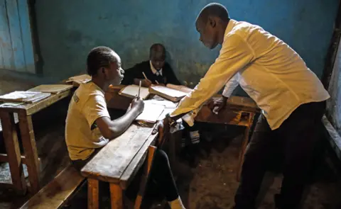 EPA Students in a classroom with their teacher in Kibera slum, Nairobi, Kenya - Monday 28 January 2019