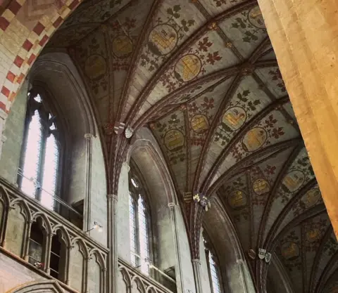 Katy Lewis/BBC The painted ceiling in the presbytery