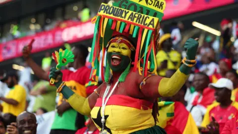 Getty Images A Ghana fan celebrates during the World Cup.