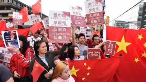 AFP Pro-Chinese government supporters protest in Vancouver