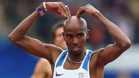 Getty Images Mo Farah crosses the finish line