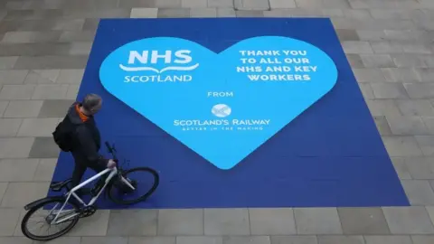PA Media A heart-shaped sign thanking NHS workers