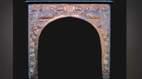 Pluck family Copper peacock fire surround