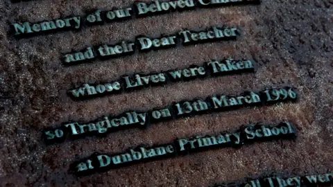 PA memorial plaque at the entrance to the Garden of Remembrance at Dunblane Cemetery