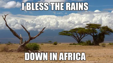 Getty Images A meme of Mount Kilimanjaro with the words "I bless the rains down in Africa"