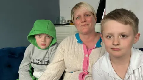 Andrew Turner/BBC Becky with her sons Joshi and Gethin
