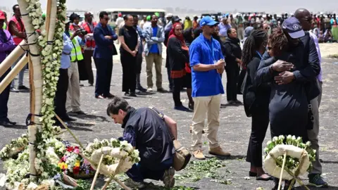 Getty Images Families at the Ethiopian Airlines crash site